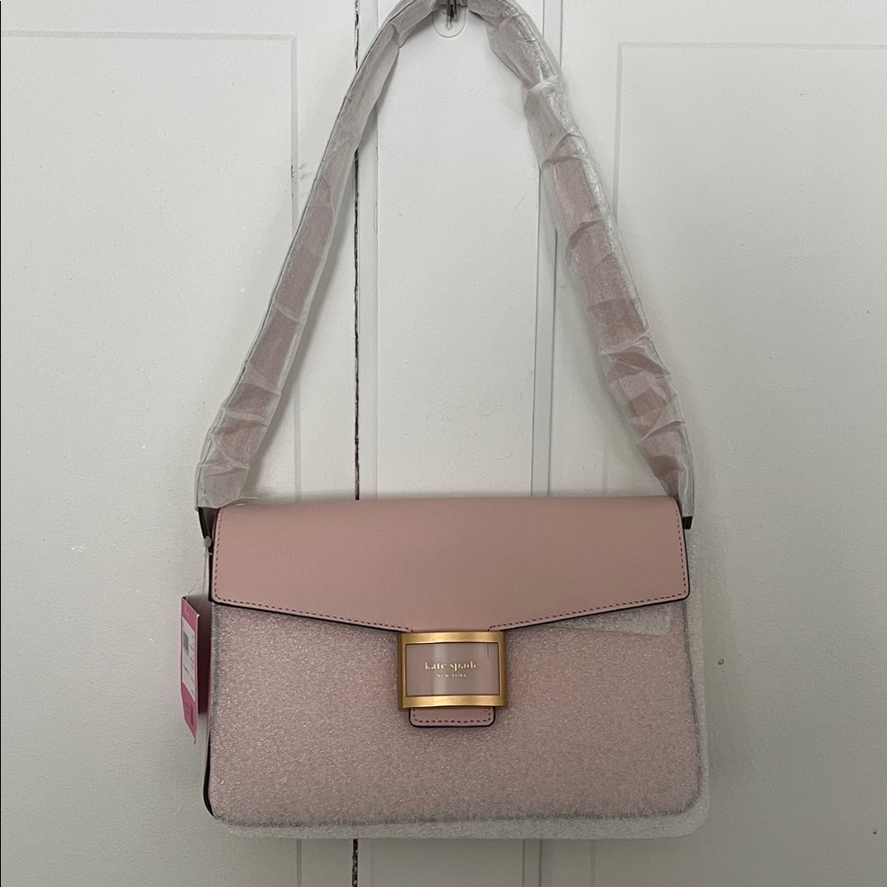 kate Spate medium convertible shoulder bag in the color Mochi Pink